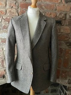 "Vintage green and brown tweed jacket in pure new wool by Crombie for Centaur.  Details: notch lapels, button hole, handkerchief pocket, side pockets with flaps, three interior pockets, lined in tonal viscose, two button fastening with matching trio of buttons on cuffs, single rear vent.  Size 40 Measurements Flat  Pit to Pit  Shoulder to Shoulder 20\" 51cm Sleeve 24\" 60cm Length 29 1/2\" 75cm Outstanding Vintage Condition" Brown Tweed Jacket, Matching Trio, Brown Tweed, Vintage Suits, Button Hole, Tweed Jacket, Boutonniere, Green And Brown, Suit Jacket