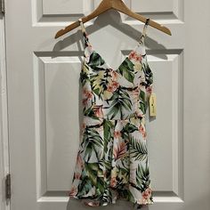 Super Cute Tropical Print Romper. The Picture Doesn’t Do It Justice. This Romper Looks Like A Skirt In The Front Because Of The Layered Fabric. Tropical Sleeveless Floral Jumpsuits And Rompers, Tropical Floral Print Sleeveless Jumpsuit, Printed Tropical V-neck Jumpsuits And Rompers, Tropical V-neck Printed Jumpsuits And Rompers, Tropical Floral Print Jumpsuits And Rompers For Day Out, Tropical Style Floral Jumpsuits And Rompers For Day Out, Casual Tropical Print V-neck Jumpsuits And Rompers, White Floral Print Jumpsuits And Rompers For Vacation, White Floral Print Jumpsuit For Vacation