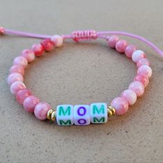 Mom Beaded Adjustable Bracelet. Gemstone: Pink Persian Jade Stone 6mm. Size: 6 Inches When Fully Closed And 10.5 Inches When Fully Open. It's Made Adjustable So It Will Fit You Just Perfectly. Great Gift For Mom, Friends, Wife, Sister Or Any Lady In Your Life. Adjustable Colorful Beaded Friendship Bracelets For Mother's Day, Adjustable Pink Gemstone Beaded Bracelets, Adjustable Letter Beads For Jewelry Making, Hand-strung Round Beads Bracelets For Mother's Day, Colorful Beaded Bracelets For Mother's Day, Hand-strung Beaded Bracelets For Mother's Day, Handmade Spiritual Beaded Bracelets For Mother's Day, Hand-strung Bracelets For Mother's Day, Pink Bracelets With 8mm Beads For Mother's Day