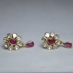 925 Sterling Silver, Ruby Gemstone & Uncut Polki Diamond Earring, Wedding Earring, Gold Plated, Polki Earring, Ruby Earring, Gift For Her. Manufacture Country : India * Customization always available for Ring size, metal selection and any type of center stones changes, etc.... * If you want to make your own idea of Jewelry we can do it. Material : 925 Sterling Silver Main Stone : Ruby Secondary Gemstone : Polki, Pave Diamond Gemstone Color :   Gemstone Shape : As Seen In A Picture Weight : 23.72 gm * Shipment will dispatch within maximum 2-3 Days of Order done * Some Special customization can take more Time * UPS, DHL, FEDEX OR ARAMEX Will be available for Delivery Sterling Silver Earrings With Stone Setting For Formal Occasions, Wedding Sterling Silver Diamond Earrings, Elegant White Earrings With Stone Setting, Diamond Gemstone Earrings In Temple Jewelry Style, Diamond Gemstone Temple Jewelry Earrings, Temple Jewelry Diamond Gemstone Earrings, Temple Style Diamond Gemstone Earrings, Temple Jewelry Gemstone Wedding Earrings, Fine Jewelry Gemstone Bridal Earrings For Wedding