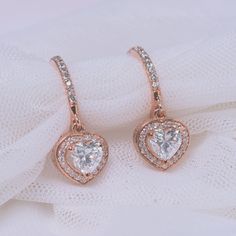 This Halo Drop Dangle Earring marvelously unleashes a classic hoop encrusted with sparkling stones holding a beautiful heart cut diamond sparkling flawlessly enclosed by a captivating halo studded with tiny shimmering round shaped stones arranged in an elegant pave setting. Further accentuating the earring is a filigree design for an added panache and splendor.  Heart and round cut diamonds of 1.39 Total Carat Weight in a prong and pave setting. Total Number of Stones:- 60  This diamond earring can also be customized with other different gemstones and metals of your preference. Free shipping within USA. 1 Year Manufacturing Warranty. 30 Days Return Policy with Lifetime Upgrade. Direct manufacturing price. Natural Conflict Free Diamonds. Pay with ease choosing from the wide range of pa Heart Halo, Halo Diamond Earrings, Silver Chain Earrings, Cobalt Blue Earrings, Teal Earrings, September Birthstone Jewelry, Unique Diamond Rings, Bridesmaid Jewelry Sets, Discount Jewelry