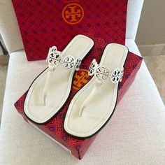 Tory Burch Tiny Miller Sandals In Ivory. Calf Leather With Leather Soles. Beautiful Elegant Sandals. Size 8. Have In Black Also On My Site. New With All Original Packaging. I Prefer These To The Original Miller’s, When Wanting To Elevate Your Look. Luxury White Sandals With Single Toe Strap, White Classic Sandals With Single Toe Strap, Classic White Sandals With Single Toe Strap, Classic White Flat Sandals, White Sandals With Branded Heel Counter, White Flat Heel Sandals With Branded Heel Counter, Classic White Sandals With Flat Heel, Luxury White Flat Heel Sandals, Chic White Sandals With Almond Toe