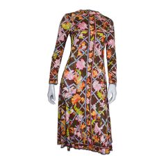 Gorgeous vintage Emilio Pucci autumnal print dress. Flowers weaving in and out of a trellis. Silk jersey in deep brown with pink, pale blue, oranges and yellows. High neck. Fitted through the waist then flares into an a-line skirt. Back zipper. Unlined. Tagged a vintage size 8. Print Silk Dress, 60s 70s Fashion, Brown Floral Print, Silk Print Dress, Vestidos Vintage, Deep Brown, Brown Floral, Emilio Pucci, 70s Fashion