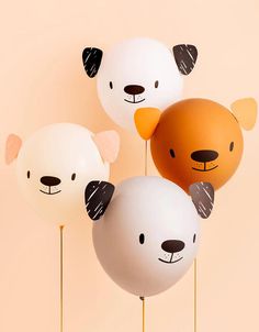 five balloons with different designs on them in the shape of bears