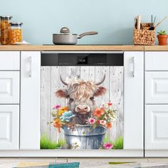 a cow is sitting in a bucket with flowers