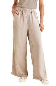 Capture that vibe wherever you are with these breezy lyocell and linen palazzo pants finished with a comfy elastic waist and handy pockets. 29" inseam; 29" leg opening; 11 3/4" front rise; 16 1/2" back rise (size Medium) Elastic waist 70% lyocell, 30% linen Machine wash, tumble dry Imported Flax Wide-leg Pants With Pockets, Effortless Summer Bottoms With Pockets, Chic Relaxed Fit Flax Bottoms, Effortless Wide-leg Bottoms With Pockets, Effortless Summer Wide Leg Pants With Elastic Waistband, Chic Flax-colored Pants With Relaxed Fit, Chic Flax Relaxed Fit Pants, Chic Flax Colored Pants With Relaxed Fit, Chic Relaxed Fit Flax Colored Pants