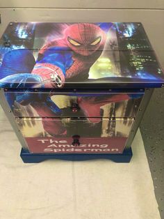 a toy chest with an image of spider - man on the front and back sides