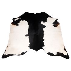 a black and white cowhide rug on a white background