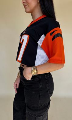 FINAL SALE Cincinnati Bengals football jersey - number 97. Black base, white breathable sides & orange sleeves. "Atkins" on the back. Never been worn. ﻿Size YOUTH large - fits similar to an adult medium. Cheap Green Tops For Football Season, Favorite Football Player Shirt, Black Sporty Baseball Jersey Fan Gear, Black Sporty Baseball Jersey For Fans, Cheap Sports Fan Baseball Jersey With Crew Neck, Black Throwback Jersey For Sports Events, Throwback Black Jersey For Sports Events, Black Varsity Jersey With Moisture-wicking, Black Moisture-wicking Varsity Jersey