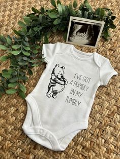 a baby bodysuit that says i've got a bumby in my tummy