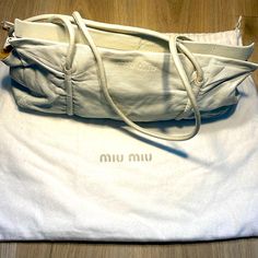 Miu Miu Beautiful Bag Has Small Stains But Hardly Noticeable Made In Canada Has A Pearl Look And Shine No Tears Or Rips Comes With Dust Bag Designer White Bag With Rolled Handles, Designer White Bags With Rolled Handles, Designer Shoulder Bag With Rolled Handles, White Leather Bag, Pearl Look, Make Color, Beautiful Bags, White Leather, Miu Miu