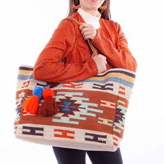 This Tote Style Wool Handbag Features Leather Handles. This Bag Will Be Useful And Great Looking Year Round In A Aztec Pattern Print In Fashion Smart Colors. Snap Closure Cream Lining Two Interior Slip Pockets And One Zipper Pocket Pom Pom Tassel Bag Charm Casual Orange Shoulder Bag For Shopping, Orange Tote Shoulder Bag For Daily Use, Casual Orange Shoulder Bag With Double Handle, Orange Beach Bag With Large Capacity For Shopping, Orange Tote Beach Bag For Shopping, Bohemian Orange Bag For Shopping, Bohemian Orange Shopping Bag, Orange Shoulder Bag With Leather Handles For Shopping, Orange Casual Beach Bag For Travel