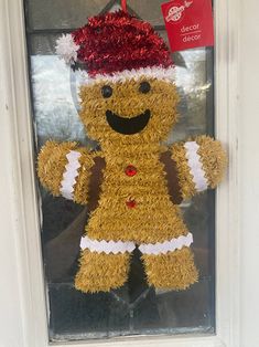 a gingerbread man is hanging on the front door