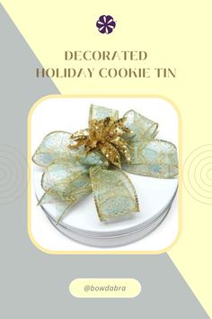 a holiday cookie tin with a bow on it's top and the words decorated holiday cookie tin below