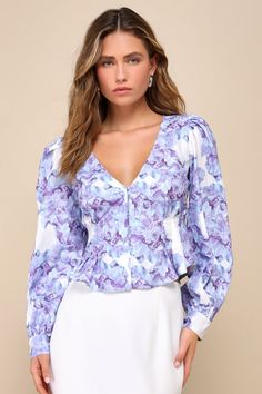 For going out looks or everyday wear, we love the Lulus Amazing Aesthetic White and Blue Floral Print Long Sleeve Top! Lightweight woven fabric, with a dramatic purple and blue floral print throughout, shapes long balloon sleeves with puff shoulders and loop-button cuffs. Fitted bodice features a V-neckline, flattering seaming details, and a functional hook-and-eye placket at the front. Rounded, slightly ruffled hems. Smocked panel at back for fit. Fit: This garment fits true to size. Length: Si Feminine Purple Top With Floral Print, Fitted Purple Floral Print Top, Chic Purple Floral Print Blouse, Purple Cotton Blouse With Floral Print, Fitted Purple Top For Brunch, Spring Purple Printed Blouse, Spring Purple Floral Print Blouse, Chic Purple Printed Tops, Casual Lavender Blouse With Floral Print