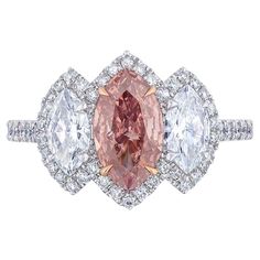 Marquise shaped Diamond weighing 1.01 Carats with GIA certificate stating the diamond is Fancy Deep Orangy Pink. Very unique color. Flanked by Marquise shaped white Diamonds weighing 0.80 Carats of F color and VS Clarity. Set in Platinum. Center prongs are in 18 Karat Rose Gold. Dig Jewelry, High Jewelry Design, Glamorous Jewelry, Gia Certificate, Pink Diamond Ring, Marquise Diamond Ring, Marquise Shape Diamond, Genie Bottle, Pink Stones