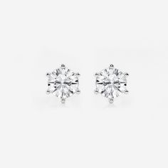 Classic and timeless, we believe everyone should own a pair of these. Set in six solid prongs in a traditional basket setting, these round lab grown diamond sparkle with the light that passes through the setting, making you shine always. Gia Certified Classic Diamond Earrings, Classic Diamond Earrings With Prong Setting For Formal Occasions, Classic White Diamond Earrings, Classic Brilliant Cut Earrings For Formal Occasions, Classic Solitaire Sterling Silver Earrings, Classic Sterling Silver Solitaire Earrings, Classic Sterling Silver Earrings With Prong Setting, Classic Earrings For Anniversary, Classic Diamond Earrings