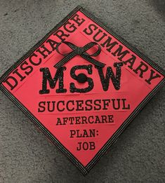 a red and black graduation cap with the words msw, successful aftercare plan job