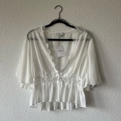 Lace White Blouse. Never Worn. Buttons In Front Feminine Chiffon Blouse For Brunch, Spring Vacation Blouse With Sheer Details, Spring Vacation Sheer Blouse, Sheer Blouse For Spring Vacation, Feminine Chiffon V-neck Top, Chic Flowy Lace Top For Summer, Flowy Chiffon V-neck Blouse, Feminine Flowy Chiffon Tops, Flowy Feminine Chiffon Tops