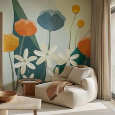 a living room scene with focus on the couch and wallpapered flower mural in the background