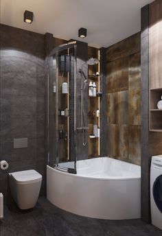 a bathroom with a tub, toilet and washer next to the shower stall is shown