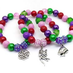 These adorable stretchy bracelets are the perfect favor for your little one's Enchanted party! Each bracelet features a Tibetan silver charm, resin rhinestone beads and a beautiful assortment of red, purple, pink and green 10mm acrylic beads strung with durable stretch floss cord. Each bracelet will arrive individually packaged in organza bags. To be the first to know about new items, sales and giveaways, mark my shop as a favorite! Follow Beaded Perfection on Instagram for special offers and co Whimsical Silver Beaded Adjustable Bracelets, Whimsical Beaded Jewelry For Birthday, Whimsical Beaded Jewelry For Birthdays, Whimsical Multicolor Charm Bracelet For Gift, Whimsical Multicolor Charm Bracelet Gift, Whimsical Adjustable Beaded Bracelets For Party, Whimsical Adjustable Beaded Bracelets With Charms, Fairy Style Adjustable Jewelry For Gifts, Whimsical Silver Beaded Bracelet Gift