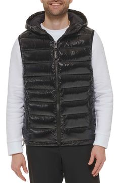 Easy to layer, this puffer-style vest features an attached hood that furthers the comfort. Attached hood Sleeveless 100% polyester Machine wash Imported Model stats: 6'1" height, 32" waist. Model is wearing size M. Hooded Puffer Vest, Puffer Style, Style Vest, Puffer Vest, Hooded Jacket, Nordstrom Rack, Puffer, Calvin Klein, Nordstrom