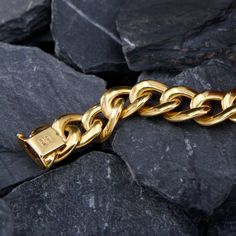 This fashionable bracelet is composed of large, semi-hollow, soft curb links. We have left this stunning piece unpolished to highlight the soft look. The bracelet is crafted in 14k yellow gold, has an Italian stamp, and is finished with a tongue closure and figure-eight safety clasp. Luxury Gold Jewelry With Thick Band, Modern Bracelets With Chunky Cuban Link Chain, Modern Chunky Chain Cuban Link Bracelets, Classic Tarnish Resistant Cuban Link Bracelet, Classic Gold Bracelet With Chunky Chain, Elegant Cuban Link Bracelet With Solid Construction, Formal Yellow Gold Chunky Chain Bracelet, Modern Cuban Link Formal Bracelets, Modern Cuban Link Jewelry