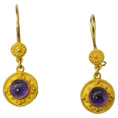 Made from luxurious 18k yellow gold, these mid-century earrings feature mesmerizing amethyst gemstones with a total weight of 2.24 carats, each exhibiting deep saturation and natural earth-mined beauty. The cabochon cut enhances the richness of the gemstones, while the earrings weigh 4.40 grams in total and measure 1.33 inches long, making them an exquisite addition to any jewelry collection. Key Features: Metal: 18k yellow gold. Gemstone: Amethyst. 2.24 carat total. Cabochon cut. 100% natural e Mid Century Earrings, Pearl Dangle Earrings, Medieval Jewelry, Pearl Earrings Dangle, Antique Earrings, Natural Earth, Modern Earrings, Amethyst Gemstone, Writing Inspiration