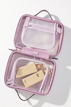 This travel makeup bag strikes the perfect balance between size and functionality, fitting snugly in your carry-on while providing ample space for all your beauty essentials. Designed with transparency in mind, you won't leave anything behind with this makeup case. | Medium Clear Cosmetics Case by CALPAK in Purple at Anthropologie Clear Toiletry Bag, Xmas Wishlist, Makeup Organizers, Carry On Bag Essentials, Travel Makeup Bag, Clear Bags, Makeup Bags Travel, Purple Bags, Tried And True