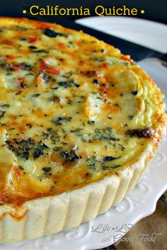 a quiche with cheese and spinach on a white plate