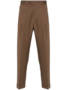 tobacco brown virgin wool blend pressed crease box-pleat detail belt loops mid-rise concealed fly and button fastening straight leg turn-up cuffs two side slash pockets two rear jetted pockets Brown Tailored Tapered Leg Bottoms, Tailored Brown Bottoms With Tapered Leg, Tailored Brown Tapered Leg Pants, Classic Brown Bottoms With Straight Hem, Classic Dress Pants With Belt Loops For Fall, Classic Tapered Dress Pants For Fall, Brown Tapered Leg Business Casual Bottoms, Brown Tapered Leg Bottoms For Business Casual, Classic Bottoms With Welt Pockets And Straight Hem