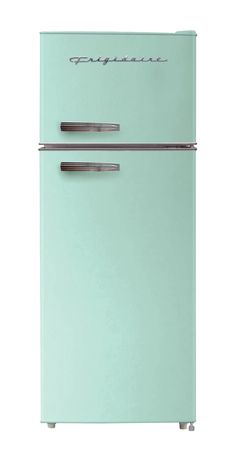 a mint green refrigerator freezer sitting on top of a white counter next to a wall