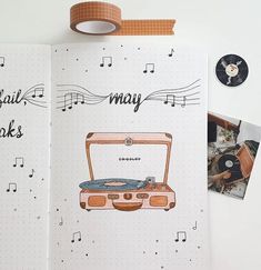 an open notebook with music notes, record players and tape recorders on the pages