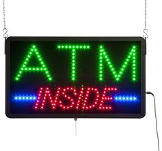 an atm sign with the word atm on it's front and back sides, all lit up