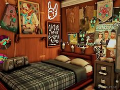 a bed room with a neatly made bed and posters on the wall above it's headboard