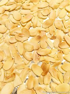 peeled pumpkin seeds on a baking sheet