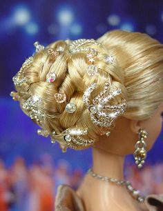 a barbie doll with blonde hair wearing a tiara