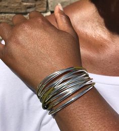 Wrap your wrist with style with this bold & beautiful leather cuff wrap bracelet that features multiple strands of leather cords accented with moveable tube beads that are secured together with a strong magnetic clasp.Every item is handcrafted by me and arrives in a lovely black kraft gift box; ready for gift giving or keeping for yourself!Watch Video: https://www.youtube.com/watch?v=JtI11KpEn2M> Multi Strands of 2mm leather cord> Silver-plated tube accents> Very strong magnetic cla Adjustable Wrap Bangle Bracelet, Adjustable Unique Wrap Bangle Bracelet, Unique Adjustable Wrap Bangle Bracelet, Spring Adjustable Bohemian Cuff Bracelet, Hand Wrapped Multi-strand Wrap Bracelet, Adjustable Multi-strand Bracelet, Hand Wrapped Metal Cuff Bracelet, Bohemian Style Stackable Wrap Bracelet, Adjustable Stackable Multi-strand Wrap Bracelet