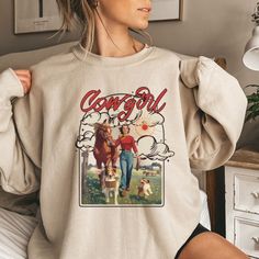 The Cowgirl Country Western Sweatshirt is the perfect addition to any preppy wardrobe, featuring an oversized design and coastal cowgirl graphics that will make you stand out at your next country concert or Nashville trip. Whether you're a granola girl or just love the yeehaw aesthetic, this hoodie is a must-have for any cowgirl at heart:)   *USUALLY SHIPS WITHIN 1-4 DAYS* -Gildan crewneck sweatshirt -For oversized look size up 1-2 sizes -Comfy & Cozy -Ink designs -Collar is ribbed knit, so it r Oversized Retro Sweatshirt, College Retro Sweatshirt, Cute Oversized Cotton Sweatshirt, Oversized Cute Cotton Sweatshirt, Retro Oversized Sweatshirt For Spring, Oversized Retro Sweatshirt For Spring, Retro Oversized Hoodie Sweatshirt, Retro Relaxed Fit Hoodie For Fall, Vintage Style Oversized Sweatshirt