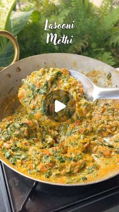 a pan filled with food sitting on top of a stove