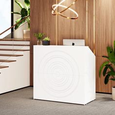 a white reception desk sitting in front of a wooden wall next to a stair case