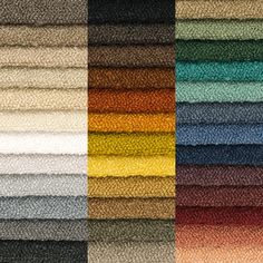 several rows of different colored towels stacked on top of each other, all in different colors