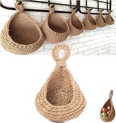 there are several baskets hanging on the wall and one has an egg holder in it