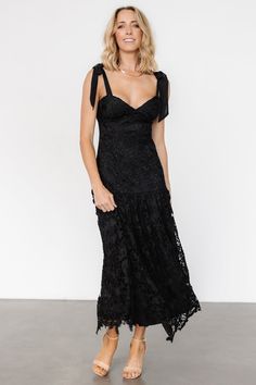 Timeless charm and modern details create a memorable look Black lace over lining Sweetheart neckline Padded bust Hidden zipper at back for closure Self-tie sleeve straps Single-tiered skirt Self and Lining: 100% Polyester Trina is 5'6, cup size 32D, size 2 and is wearing size S Lace Dress With Tie Back And Sweetheart Neckline, Chic Black Lace Dress With Sweetheart Neckline, Elegant Lace Dress With Lace-up Back, Elegant Lace Dress With Tie Back, Evening Lace Dress With Tie Back, Lace Evening Dress With Tie Back, Elegant Evening Lace Dress With Lace-up Back, Lace Party Dress With Tie Back, Chic Lace Dress With Lace-up Back