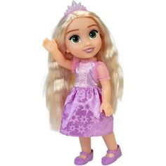 a doll with long blonde hair wearing a purple dress and pink slippers, standing in front of a white background