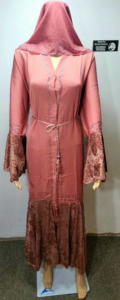 Original Dubai abaya, directly shipped from Dubai. Material of this abaya is Nidah. Pink color with embroidered lace & rhinestones down the front and back.  An exquisite abaya adorned with rhinestones is a true work of art. The abaya is crafted from high-quality, flowing fabric that drapes elegantly over the wearer's body, adding a touch of luxury and sophistication to any occasion. CHEST SIZES ARE PROVIDED IN INCH IN THE DROP-DOWN BAR. For example, size 54 (Chest 44-45) means Abaya length is 54 inches and chest is 44 to 45 inches. expect 1   inch + or - due to stitching reason.  We believe in providing Real Pictures and videos of the products. With Real Pictures, you can trust that what you see is what you get. Say goodbye to stock photos and hello to authentic product visuals that truly Bohemian Maxi Length Abaya For Eid, Modest Long Abaya For Eid, Modest Long Abaya For Festive Occasions, Bohemian Floor-length Abaya For Eid, Bohemian Floor-length Abaya With Dabka, Festive Modest Long Abaya, Festive Long Modest Abaya, Festive Modest Maxi Length Abaya, Bohemian Floor-length Dabka Abaya