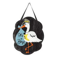 a stork with a baby bag hanging from it's back on a wall