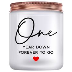 a white jar with the words one year down, forever to go written on it