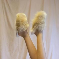 Pamper your feet and keep them snug, even on the coldest days, with these irresistibly soft slippers alpaca.Soft alpaca slippers are handmade by Peruvian artisans who deal with freezing temperatures in the Andean Highlands on a daily basis.The outer lining of these alpaca slippers is made from high quality alpaca wool; super soft. The inside is made of Merino wool: breathable, temperature-regulating, and odour-resistant.- Made of 100% Alpaca Suri.- Spot clean.- Alpaca wool outer lining.- Merino Cozy Faux Fur Slippers With Round Toe, Cozy Beige Slip-on Slippers, Comfortable Slip-on Faux Fur Slippers, Soft Cream Round Toe Slippers, Cozy Fluffy Slip-on Slippers, Fluffy Slip-on Cozy Slippers, Fluffy Comfortable Slip-on Slippers, Fluffy Slip-on Comfortable Slippers, Fluffy Slip-on Indoor Slippers